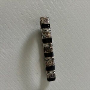 Bracelet - silver tone and black on stretch band.
